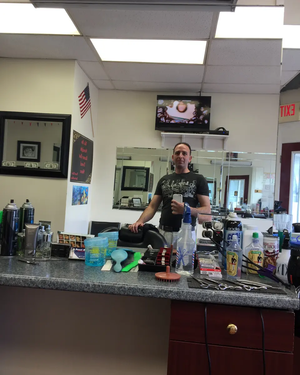 Inside Pearl River Barber Shop on Central Ave, the counter and mirrors